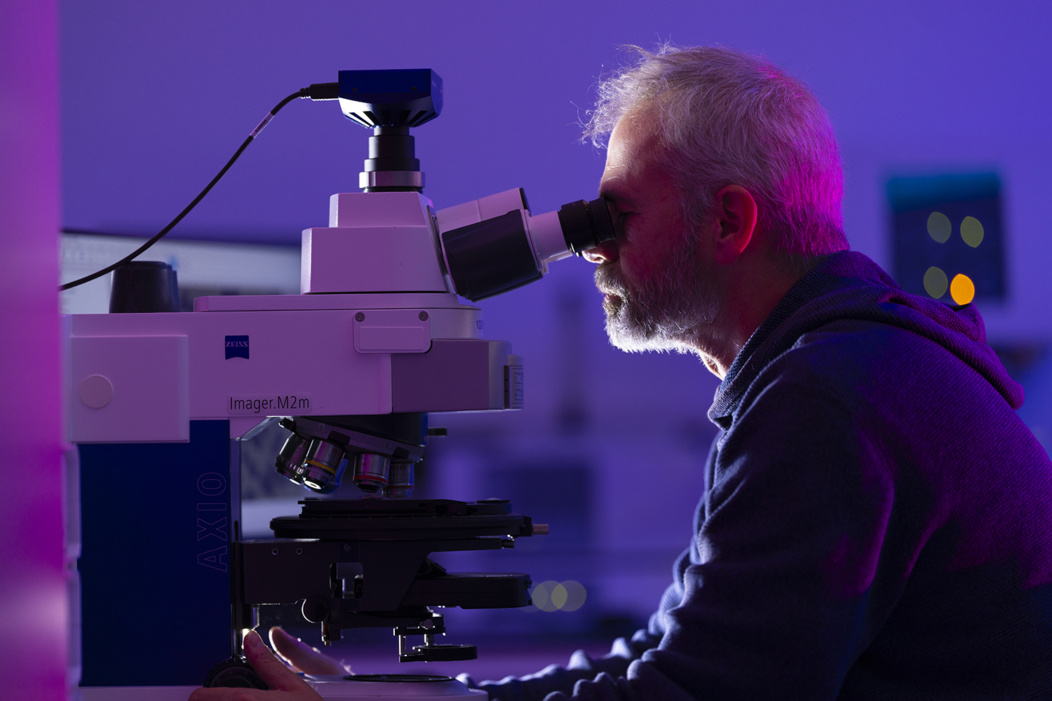 Man using a microscope