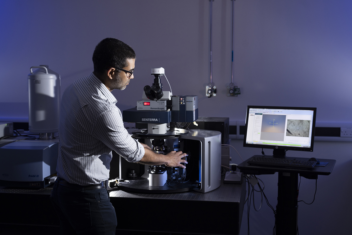 A man loading a sample onto a Raman