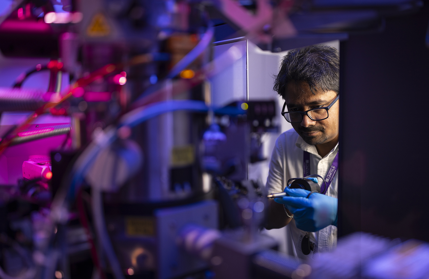 A man working on a TEM